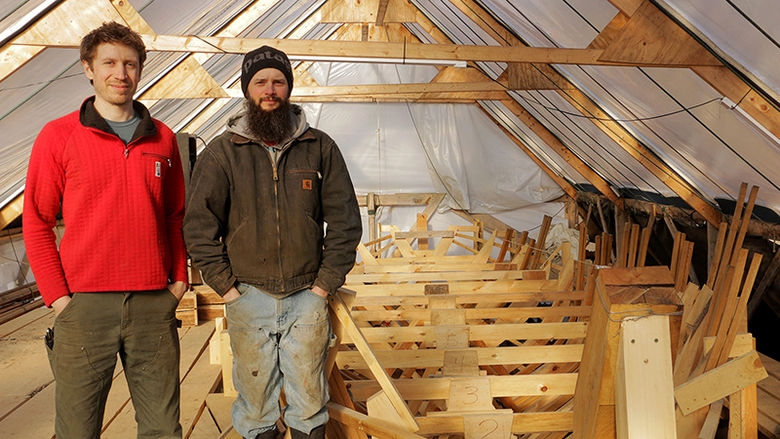 Alix Dreder and Steve Denette in front of the boat they're building