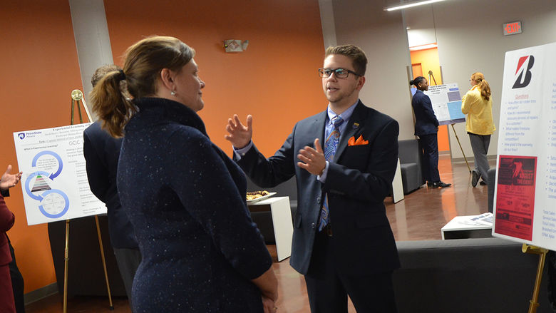 A business student presents about his internship at the fall 2017 Student Showcase