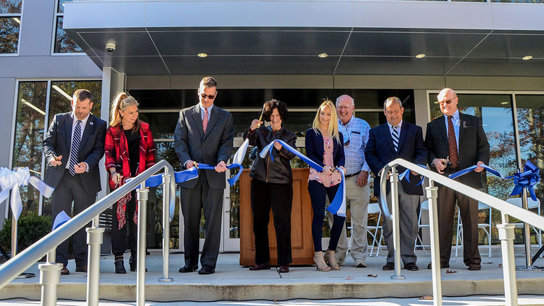 Leaders from Penn State Altoona and the community cut the ribbon during a dedication ceremony for the newly renovated and expanded Adler Athletic Complex.