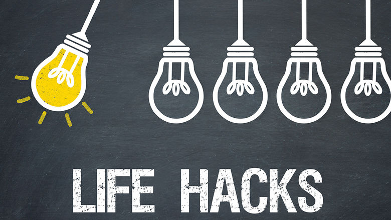 A series of lightbulbs on a chalkboard background, with the first one lit and swinging. Below, the words LIFE HACKS are written in bold, white text, symbolizing practical tips and ideas.
