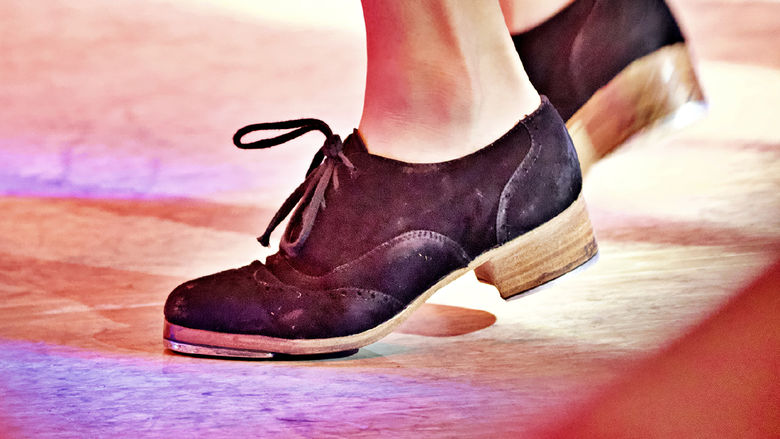 a close up of tap shoes dancing