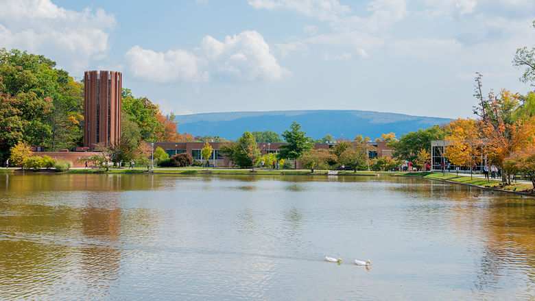 A view of the reflecting pond, Eve Chapel, and Hawthorn Building