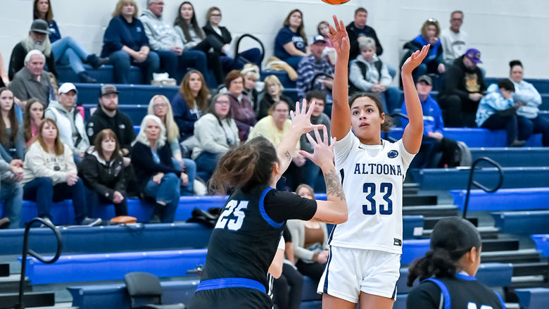 Penn State Altoona student-athlete Avana Sayles playing in a basketball gams