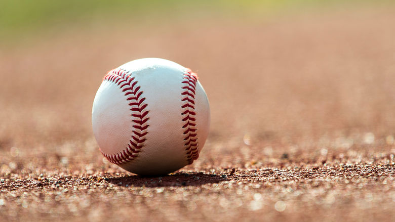 A baseball on the ground