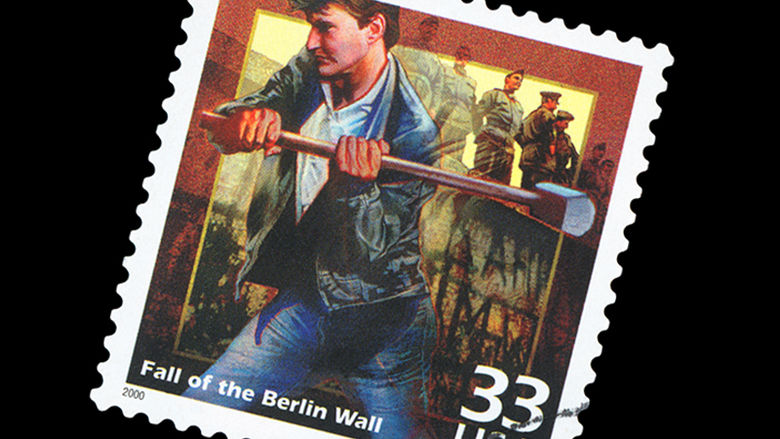 A stamp of a man breaking through the Berlin Wall