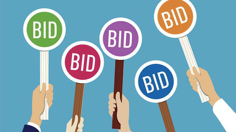 Graphic of several hands holding up signs reading 'bids'