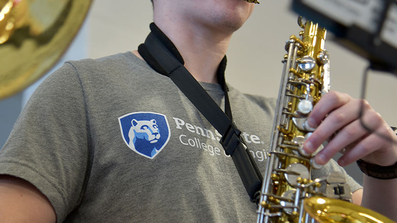 Blaine Davidson and his alto saxophone. Davidson is studying electro-mechanical engineering.