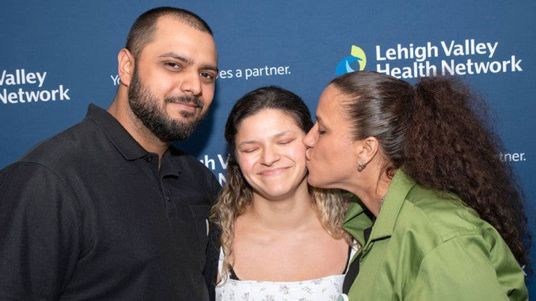 Kim Camacho with her brother Antony and mother Aida at the Trauma Survivors Ceremony.