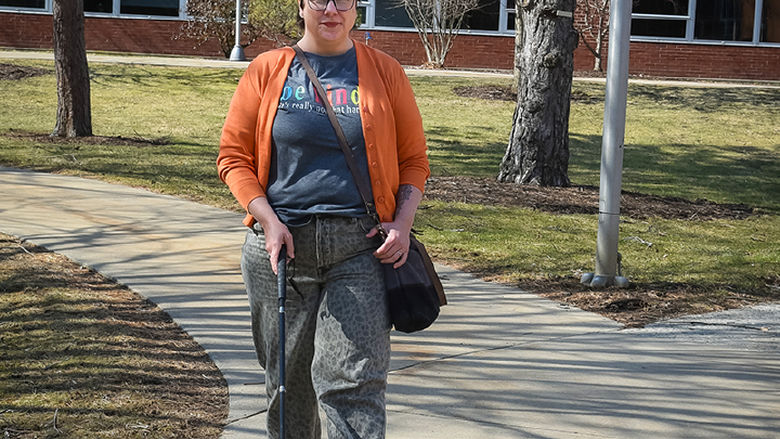 Parrish never leaves home without her mobility cane and navigates campus with its assistance.