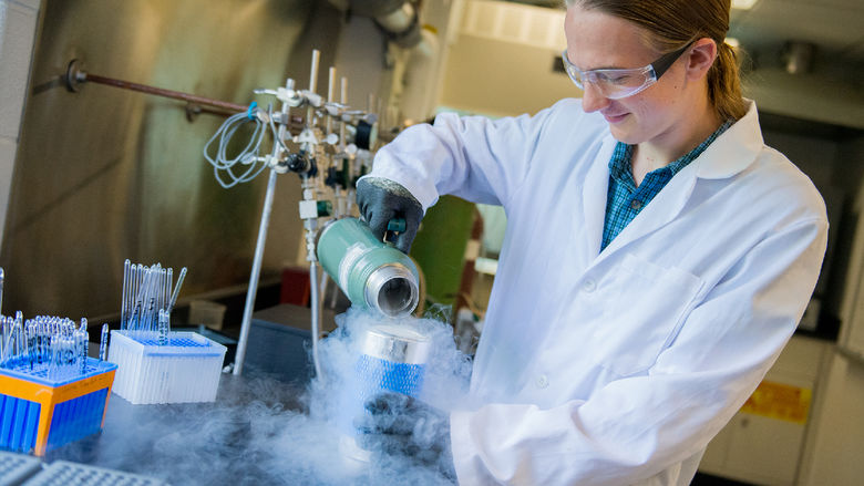 A student in a lab works on carbon dating materials
