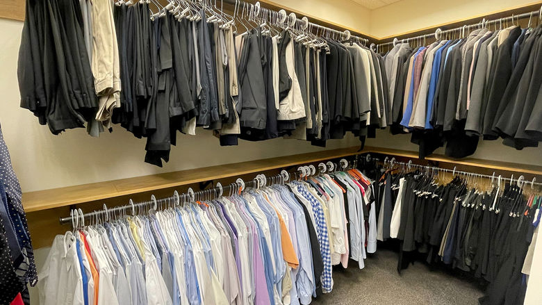 Double-decker racks of professional dress attire for men and women