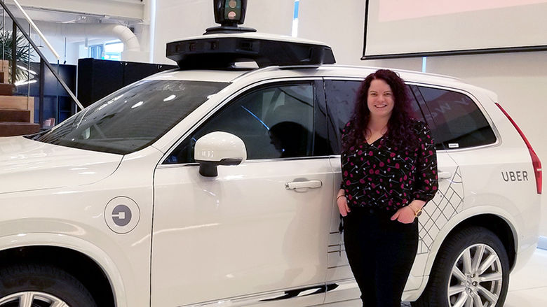 Courtney Bailey with a self-driving Uber vehicle