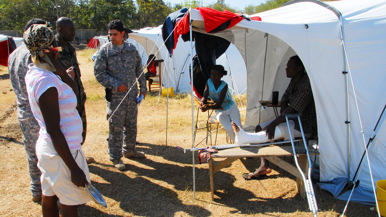 As part of the Civil Affairs team, one week after the 2010 7.0 magnitude earthquake in Haiti, Prudencio helps assess the Internally Displaced camps near the capital of Port -au- Prince.