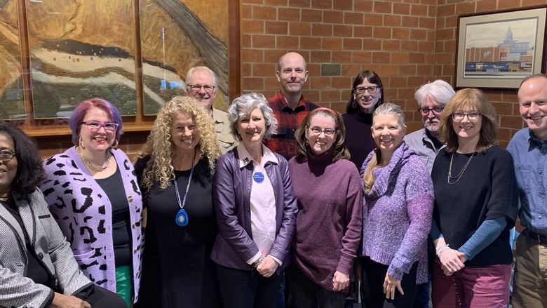 English faculty at an open mic event sponsored by the campus literary arts magazine.