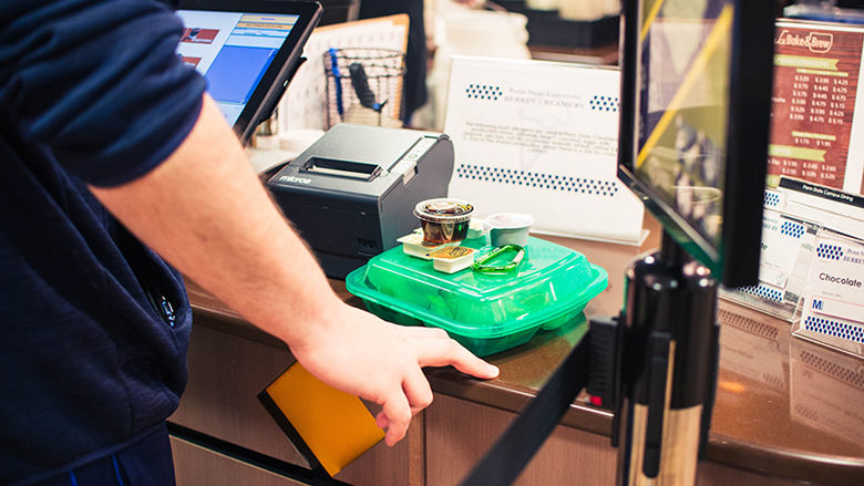 Student using a Green2Go Container at Port Sky Cafe