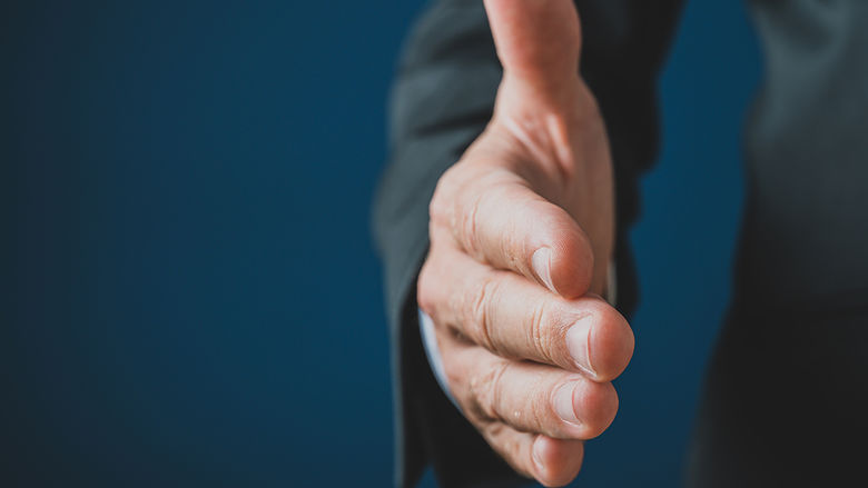 An outstretched hand seeking a handshake