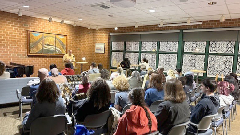 Professor Todd Davis reads from his work at the fall 2024 Hard Freight Café