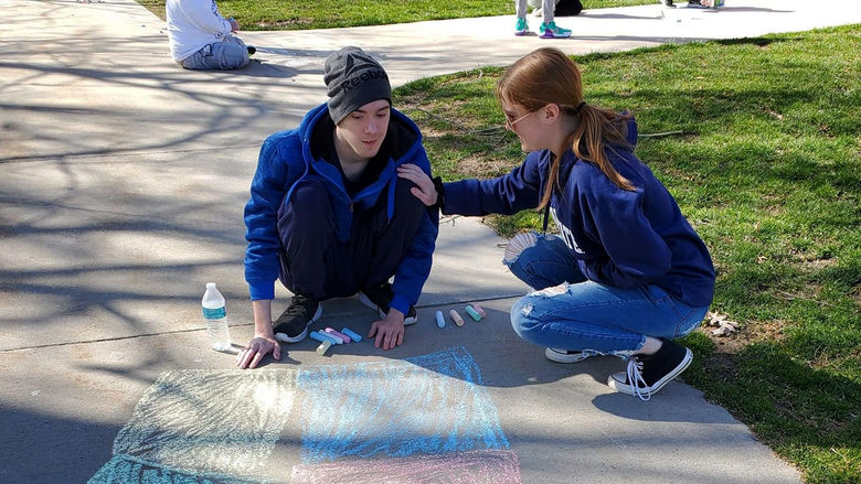 Carson and Sydney at a sidewalk chalk event through Penn State Altoona’s student organization We Are Friends.