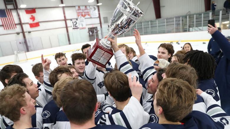 The Penn State Altoona team celebrates their College Hockey East championship win in February. 