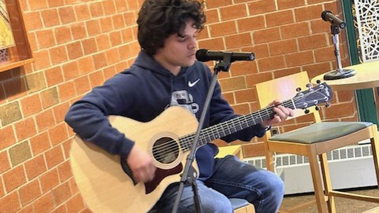 Student Josue Barahona-Rosales performs a song by Ed Sheeran.