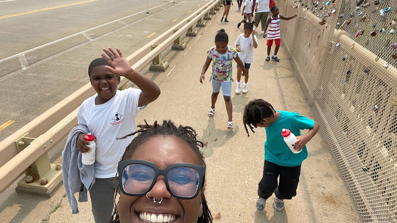 Chastity Bey and a camp group on their way to Schenley Plaza for some nature activities
