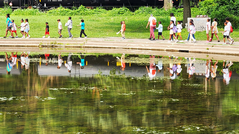 Chastity Bey leads a camp group to Schenley Park for a hike