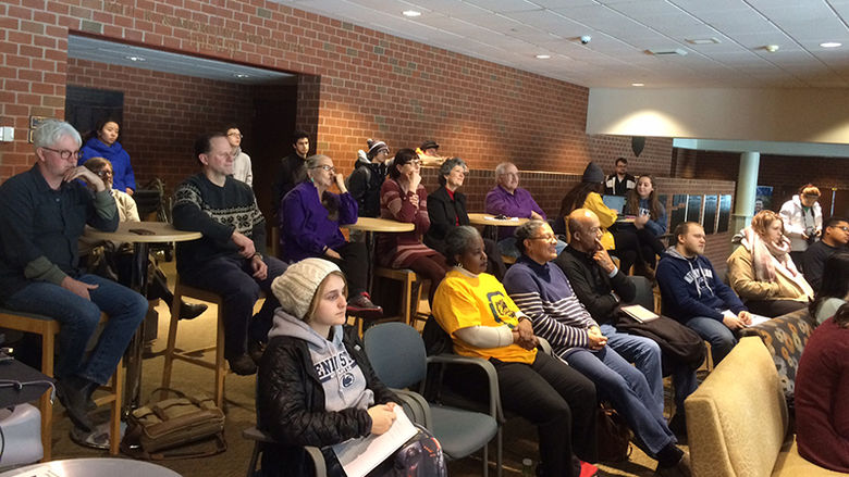 Audience members at a poetry reading by Patricia Jabbeh Wesley