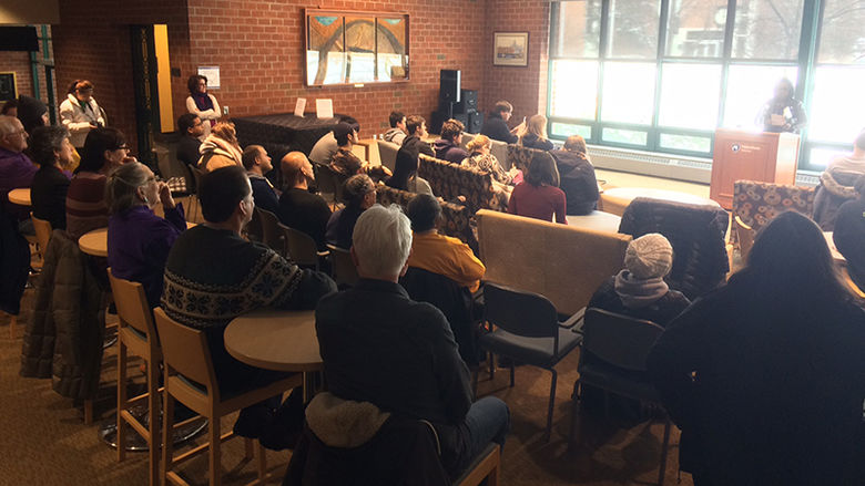Audience members at a poetry reading by Patricia Jabbeh Wesley