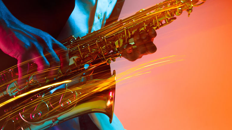 a close-up of a saxophone being played