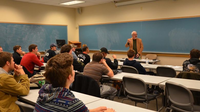 Professor White teaching a course
