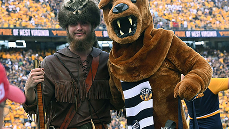 The Nittany Lion poses with the Mountaineer