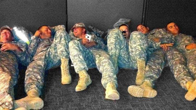 Michael Balmford with fellow soldiers at Fort Campbell, Kentucky, waiting for busses.