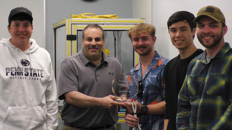 Dr. Grant Risha poses with the student team chosen as best performers in the spring 2025 Engineering Design Competition