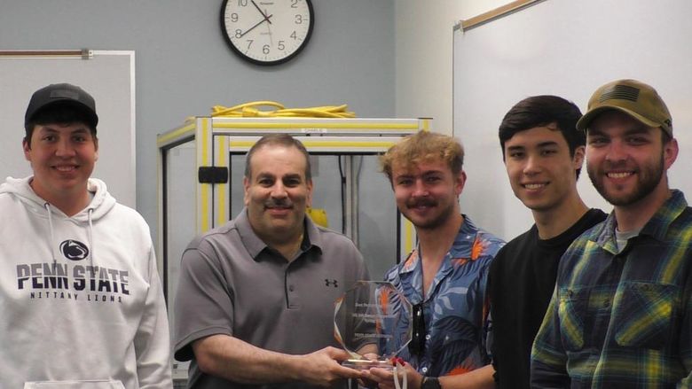 Dr. Grant Risha poses with the student team chosen as best performers in the spring 2025 Engineering Design Competition