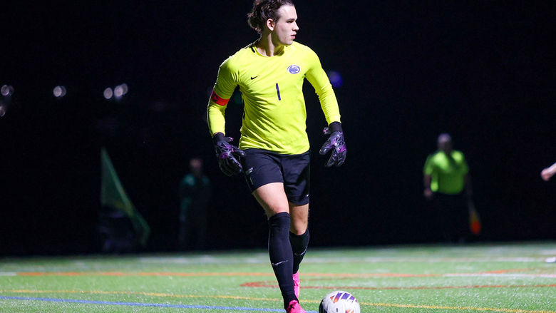 Sasha Mohoruk playing goalie in the middle of a soccer game