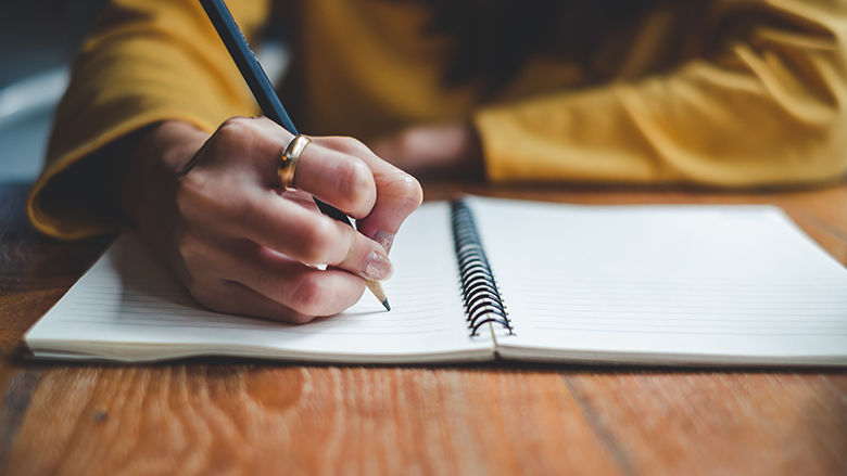 Writing in a notebook