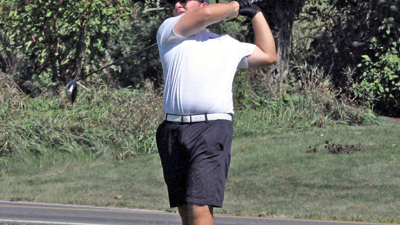 Golfer Nicky Riscica in mid-swing.