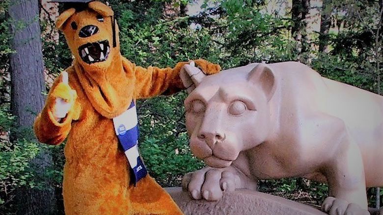 nittany lion mascot wearing graduation cap posing for a photo at Nittany Lion Shrine
