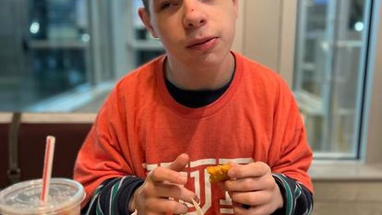 Thomas Lill eating chicken nuggets