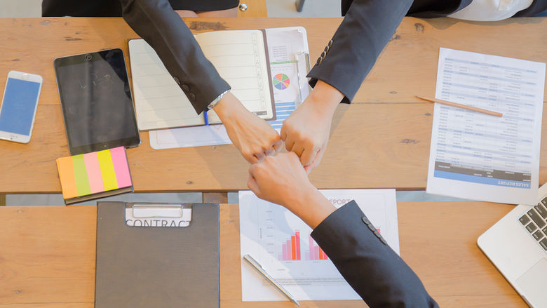 Business hands in the middle
