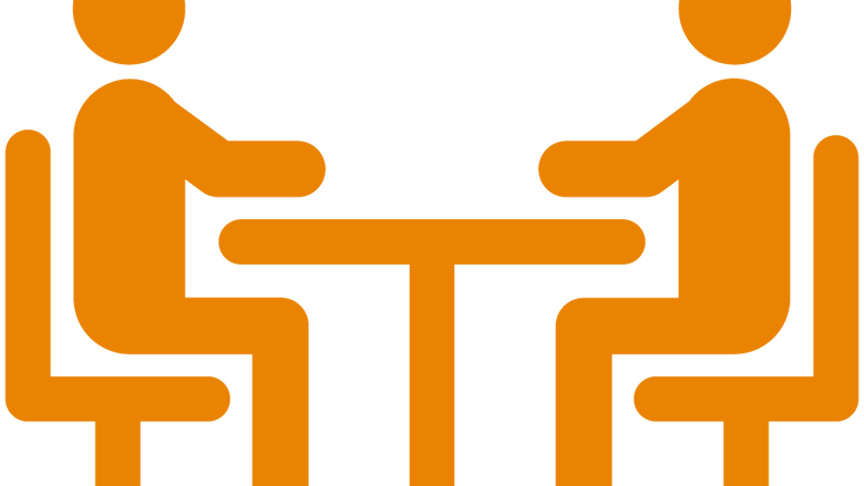 an icon representing two people seated at a table