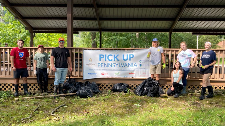 Students from Bio Club, Ag Club, and Tribeta at an annual stream cleanup event on campus.
