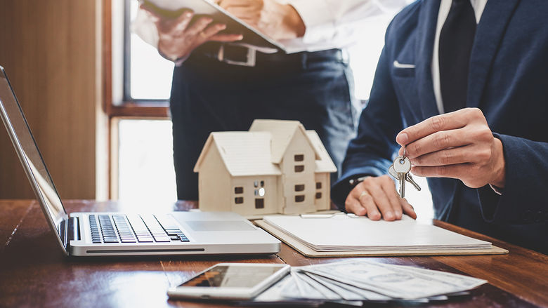 Real estate agent and Sales manager team analysis pricing of rental lease contract of sale purchase agreement, concerning mortgage loan offer for and house insurance