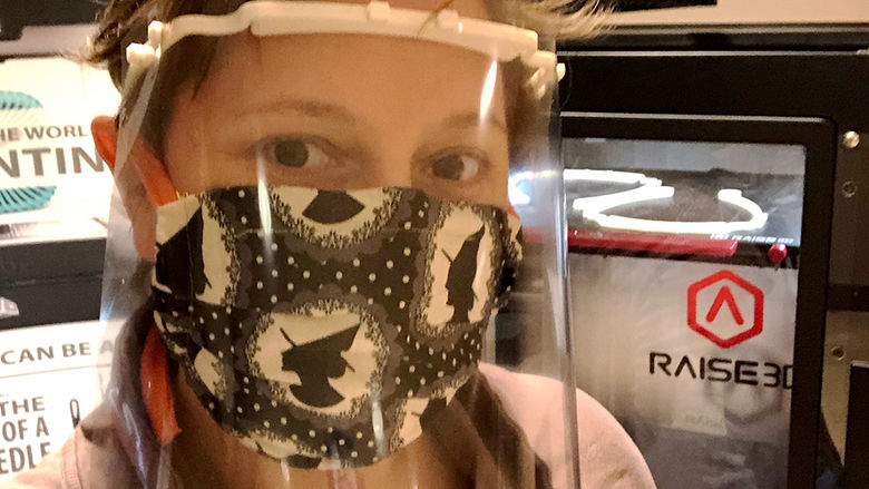 Rebecca Strzelec models a face shield with 3D printed headbands