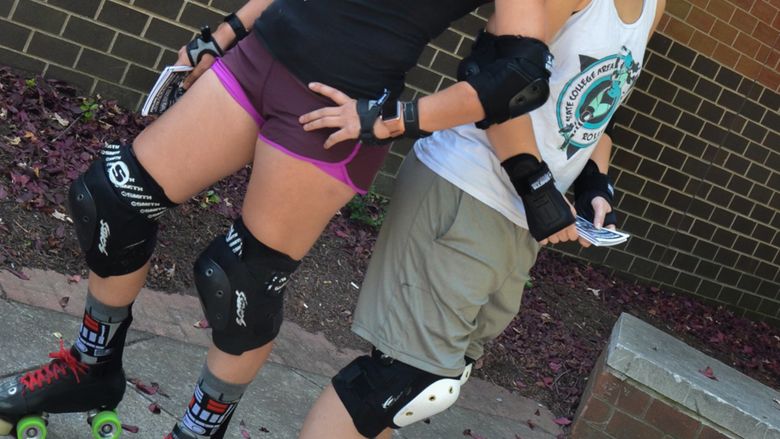 Rebecca Strzelec and Molly Kellom in roller derby gear