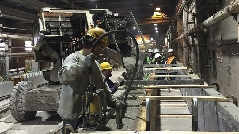 Students watching concrete casting at New Enterprise