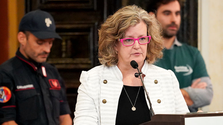 A person standing at a podium.
