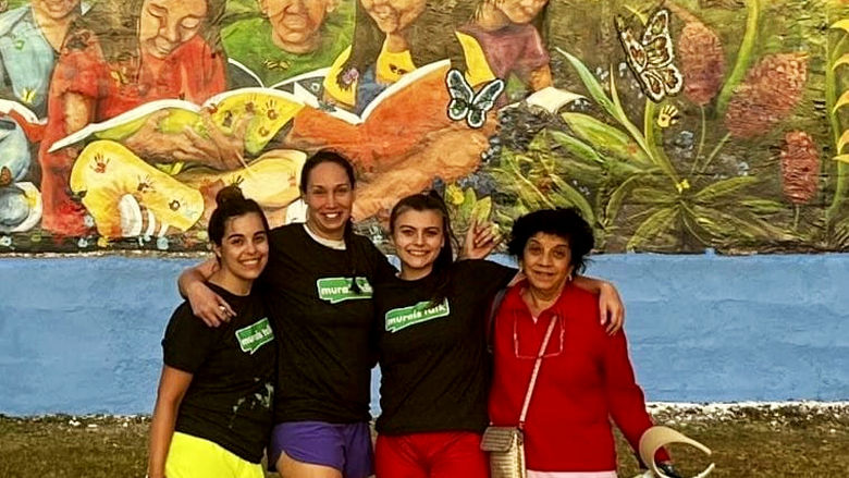 Leah Klevan, Pam Snyder, Cierra Rhodes, and Anju Jolly with the final mural