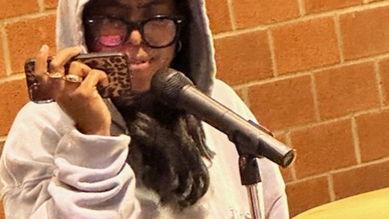 Student Liz Green performs a song by Mary J. Blige.