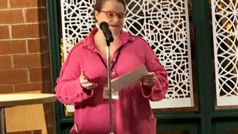 Student Rebecca Reeder introduces Professor Steve Sherrill.